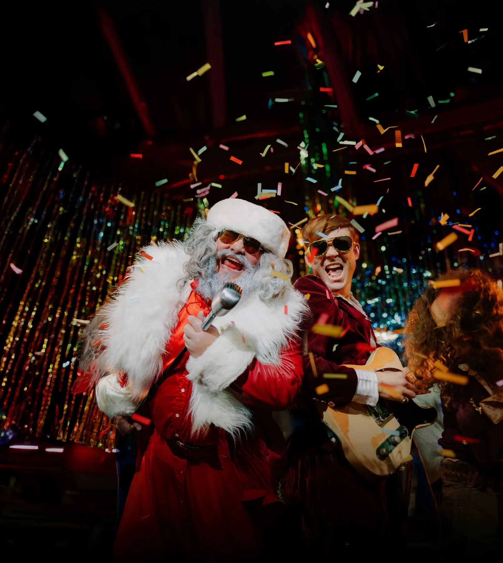 Santa and a performer on stage at Humbug
